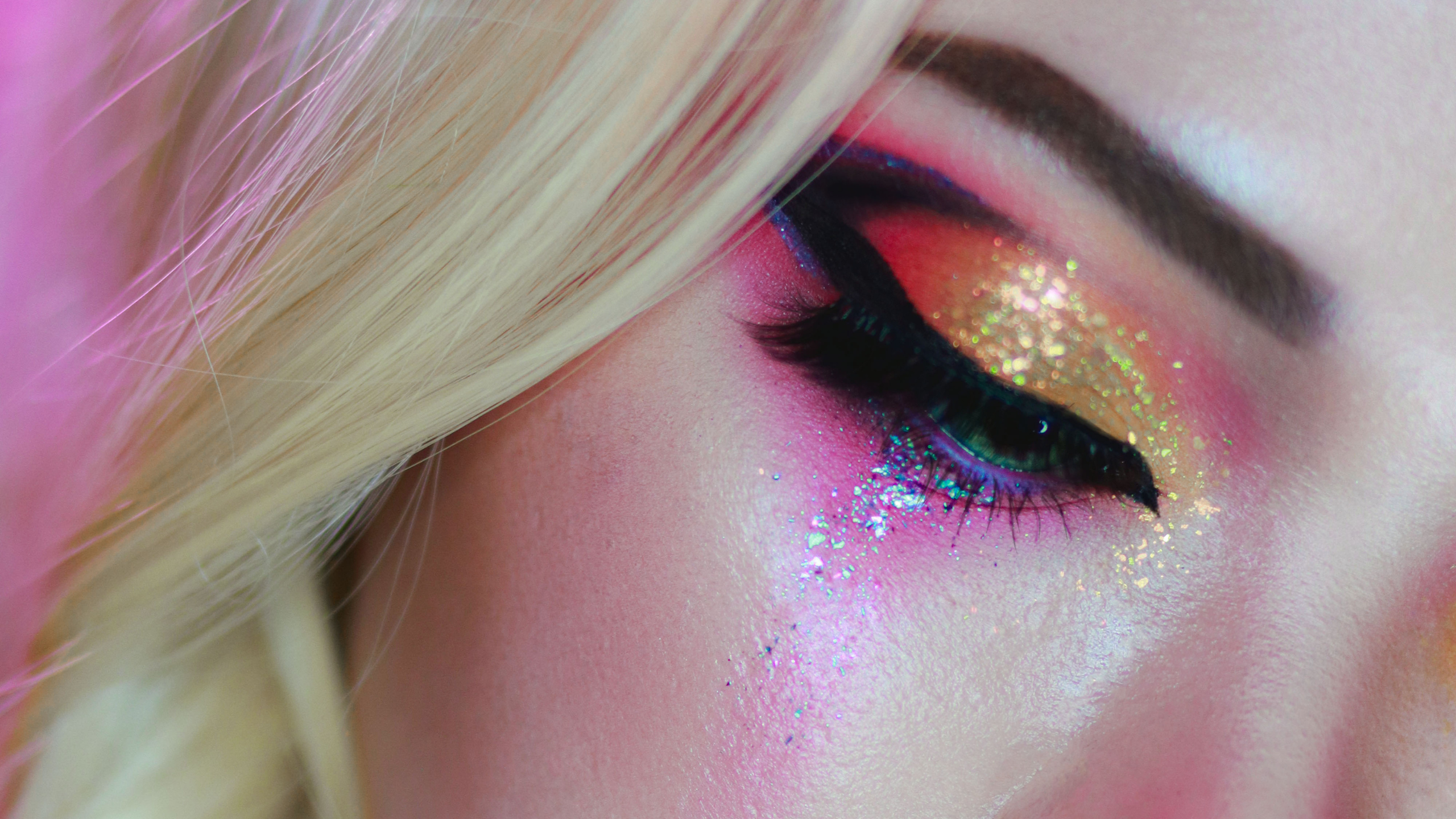 Close-up of a person's eye with colorful makeup
