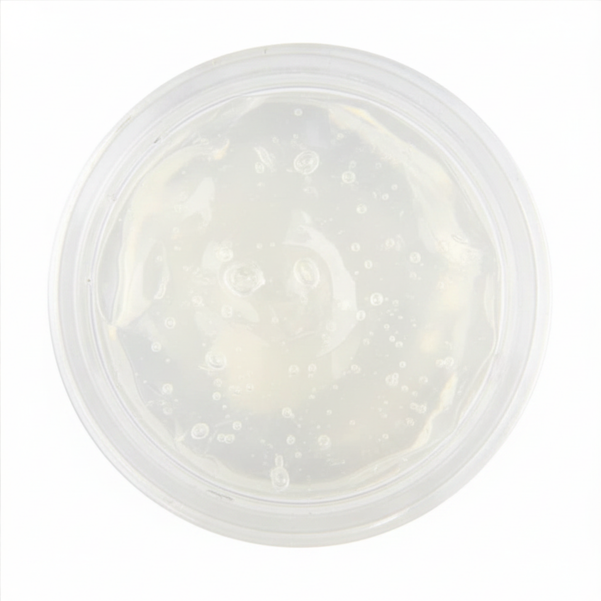 Clear aloe vera gel in cosmetic pot on white background