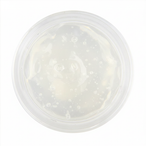 Clear aloe vera gel in cosmetic pot on white background