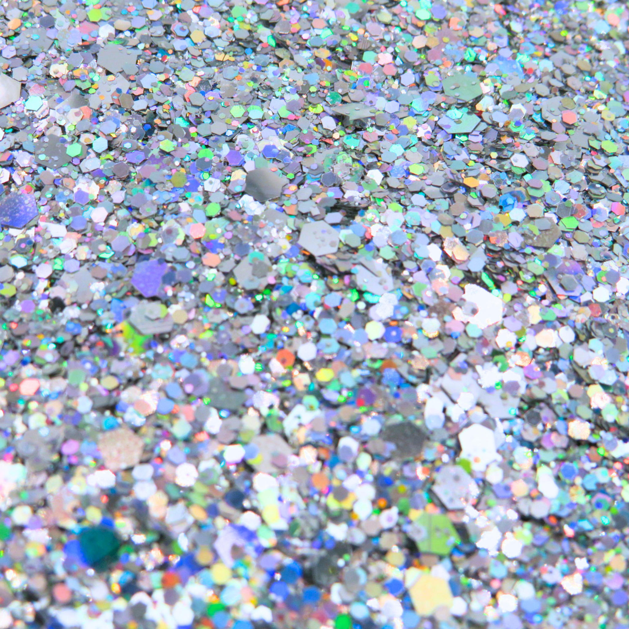 Close-up of silver holographic glitter texture showing reflective sparkle detail