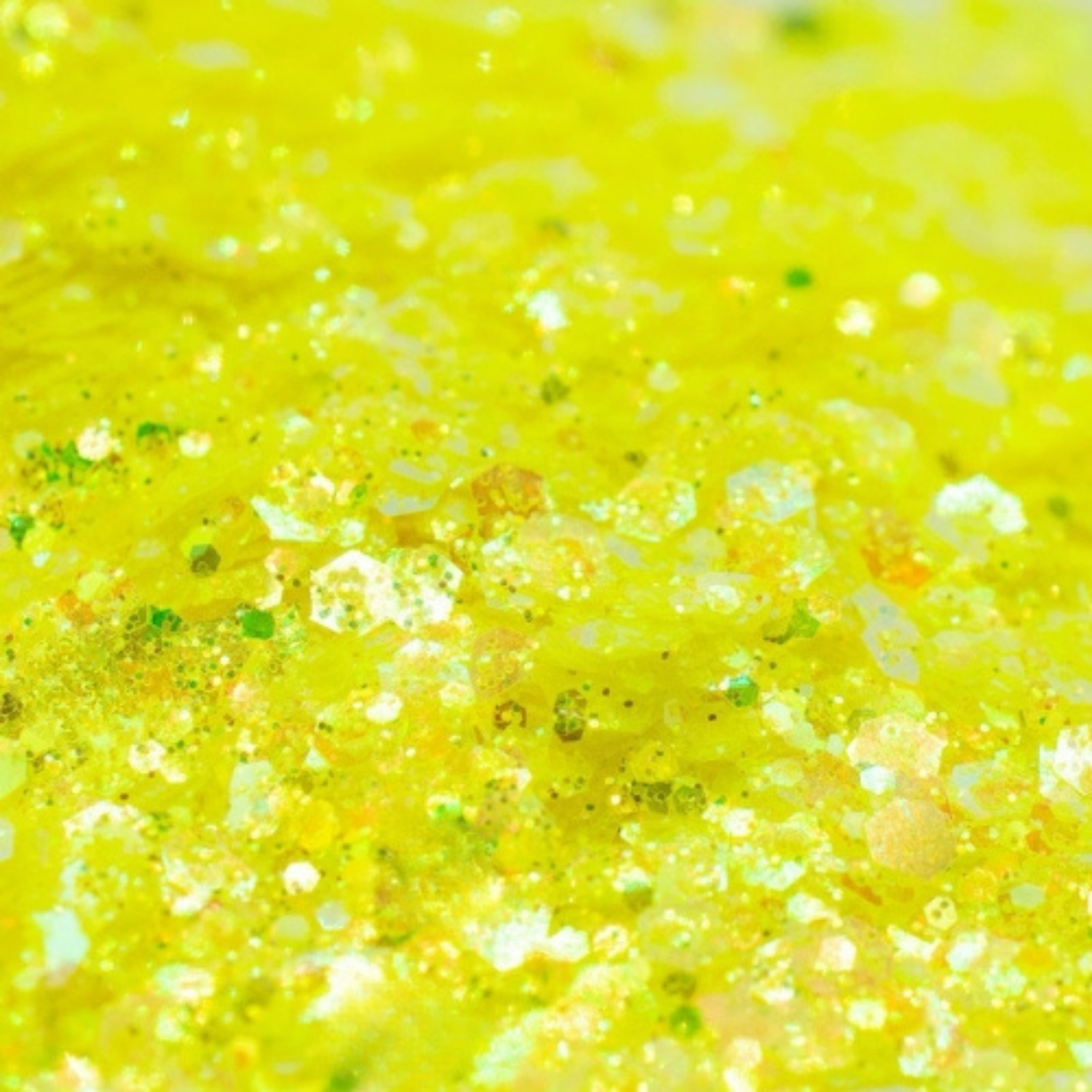 Close-up of bright yellow festival glitter texture showing fine reflective particles