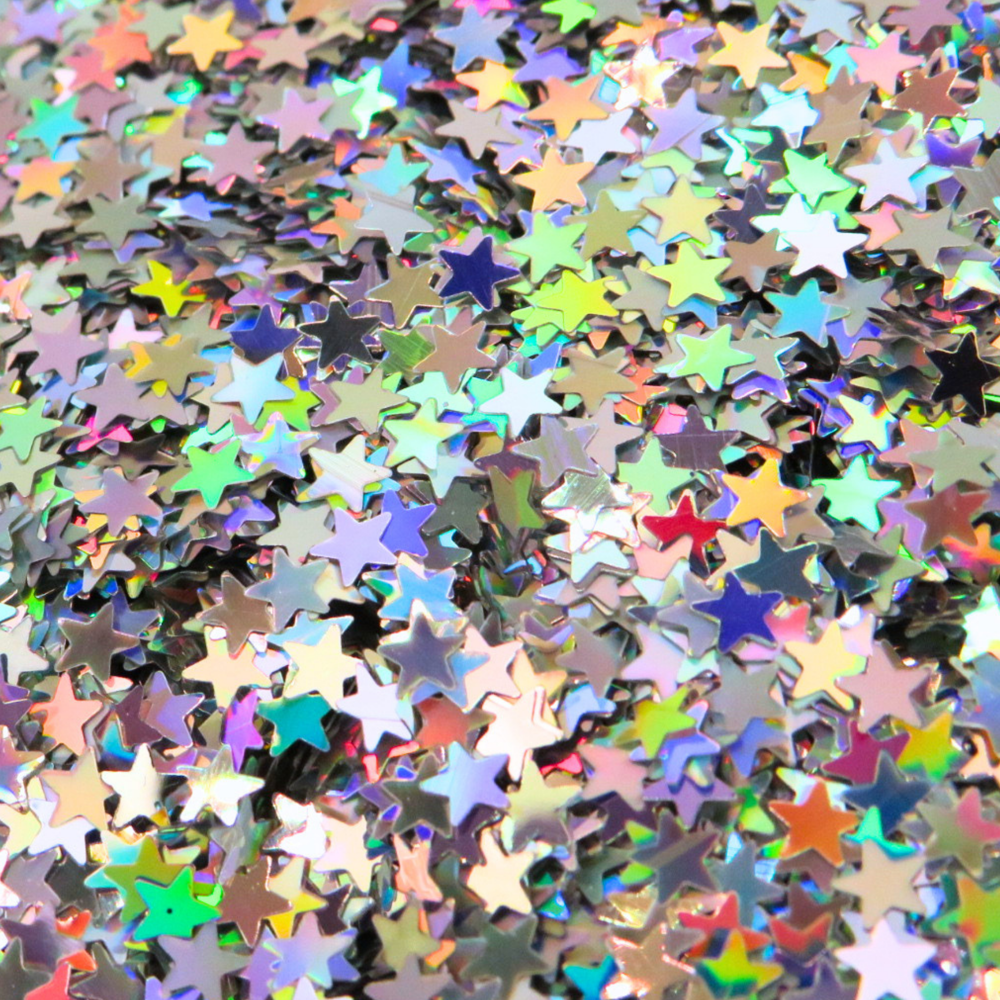 Close up of holographic stars loose glitter for face, body, hair and nail art