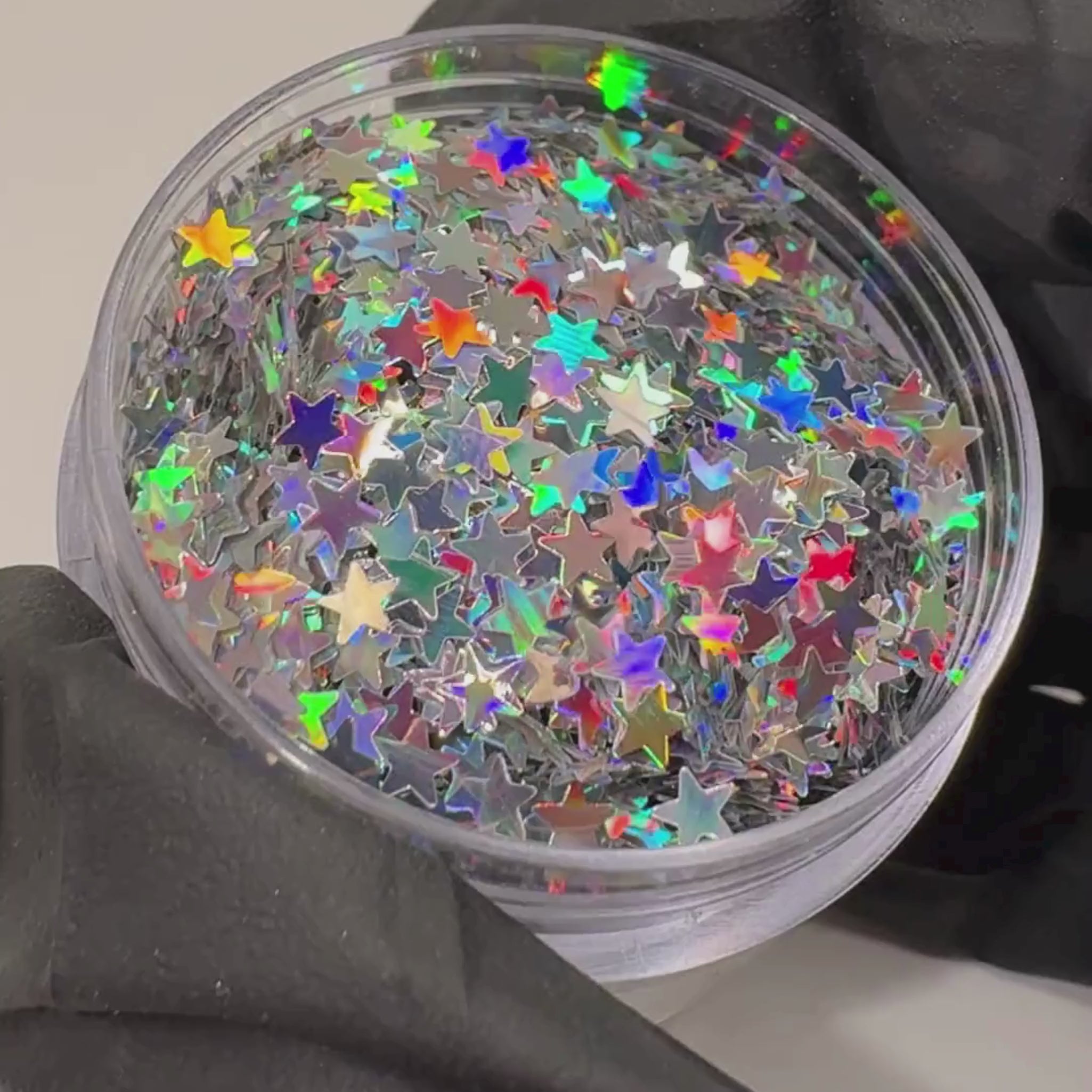 Holographic silver star glitter in a plastic pot