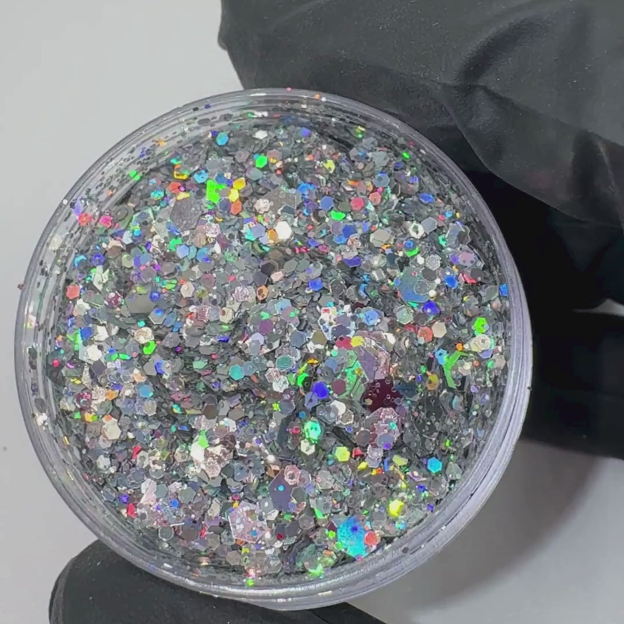 Peachipie Beauty festival glitter product video showcasing a silver holographic glitter blend in a plastic pot.