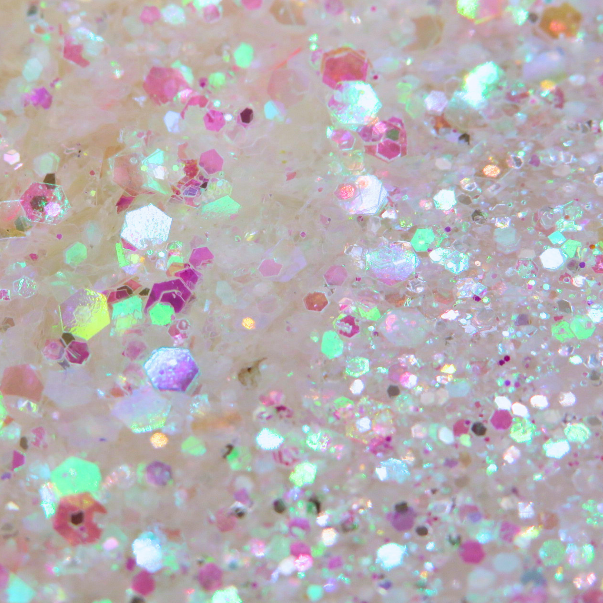 Pink and yellow iridescent chameleon glitter blend with holographic sparkle detail